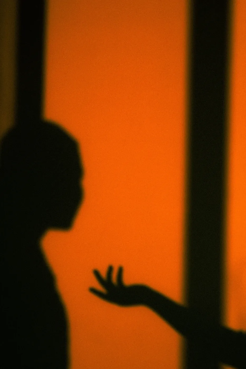 Atmospheric shadow of a child reaching out